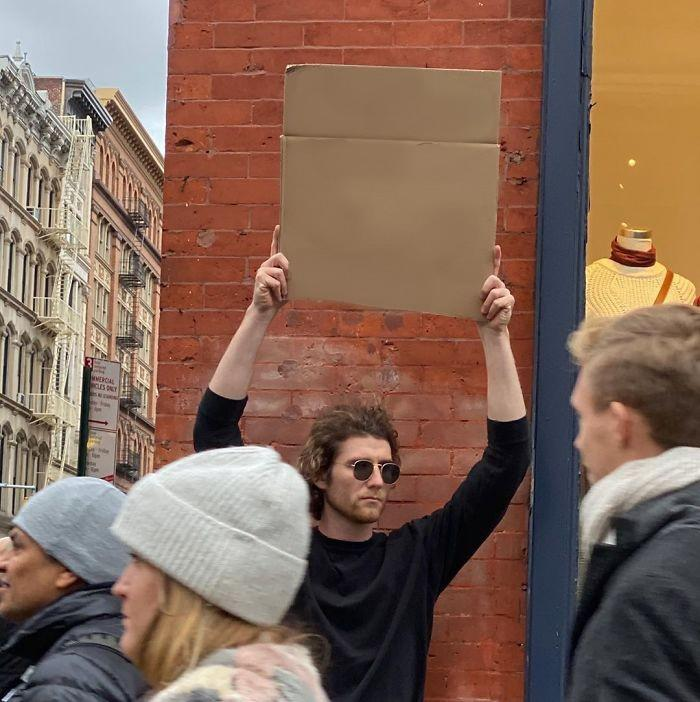 Man Holding Up Sign meme template